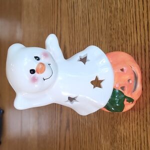 Magic Creations Ghost sitting on a pumpkin